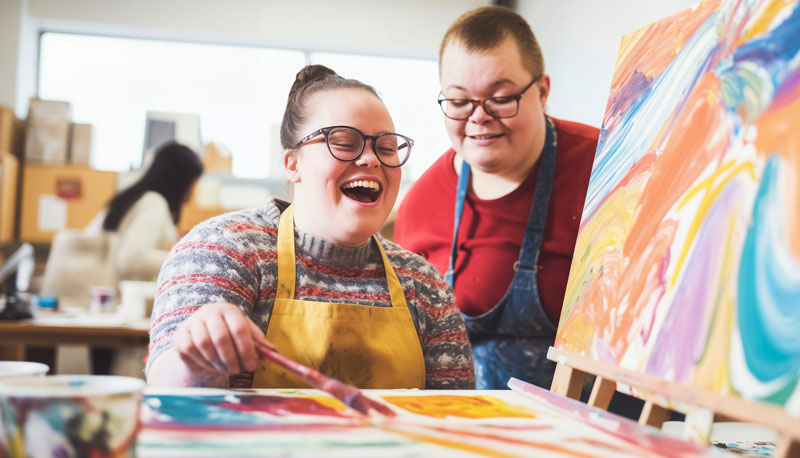 People painting in art class